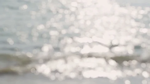 Abstract Water Surface Bokeh with Waves And Light Particles Glittering in the Stockbeeldmateriaal 129483397
