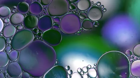 Abstract watercolor bubbles floating in vibrant liquid motion. Dynamic colorful  Stock Footage 340450312
