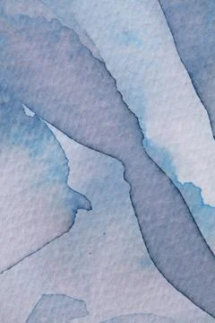 Abstract watercolor composition showcasing soft blue and gray tones with flowing Stock Photos
