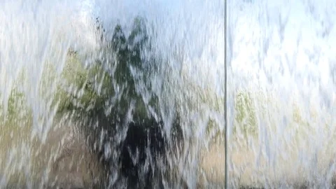 Abstract waterfall wall with tree behind Stock-Footage 80175608