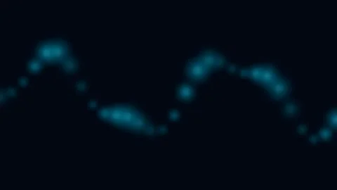 Abstract wave of glowing blue light particles on a deep black background 動画素材 338310770