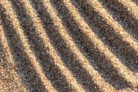 Abstract wavy pattern of sand ripple. Close-up photo Stock Photos