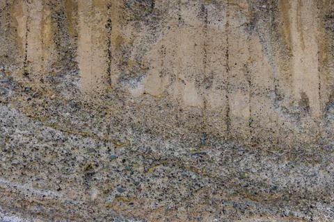 Abstract weathered concrete wall texture with visible aggregate. Stock Photos