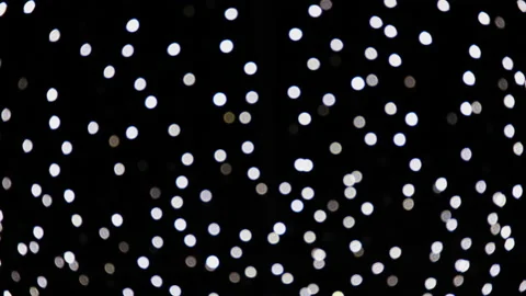 Abstract white blurred lights sparkling and glowing on black background. Stock Footage 146367818