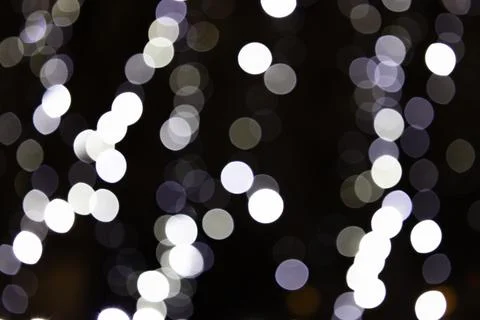 Abstract White Bokeh Lights on Dark Background Stock Illustration