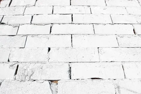 Abstract white brick wall texture depicting in paint colors on an old brick wall Photos