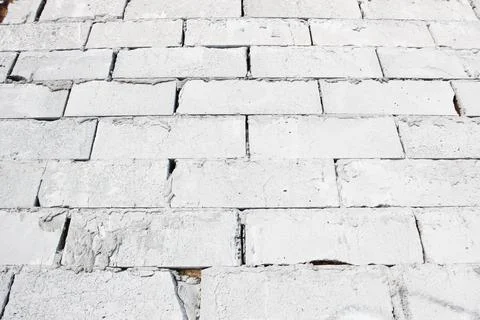 Abstract white brick wall texture depicting in paint colors on an old brick wall Stock Photos