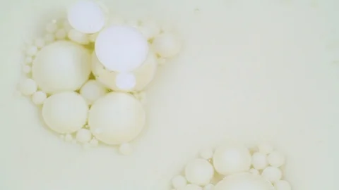 Abstract white bubbles paint. Slow motion. Top view Video stock 105174744