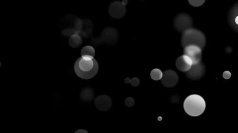 Abstract white circles floating slowly in dark empty space loop. Stock Footage 340620946
