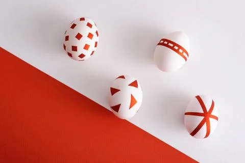 Abstract white Easter eggs with red geometric pattern on red and white backgr Stock Photos