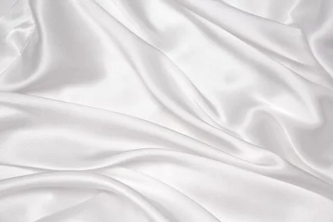 Abstract white fabric texture background. Cloth soft wave. Creases of satin.. Stock Photos