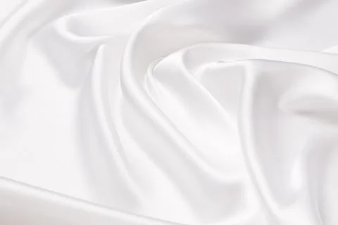 Abstract white fabric texture background. Cloth soft wave. Creases of satin.. Stock Photos