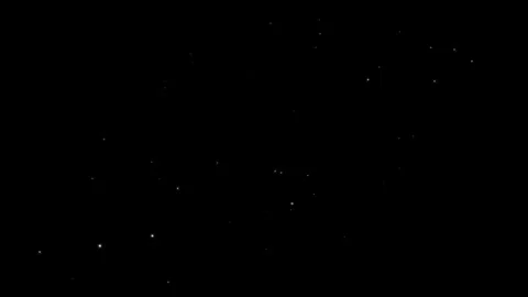 Abstract white glitter particles against a dark background, for visual effects Stock Footage 339660928