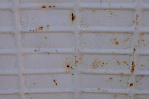 Abstract White Metal Surface with Raised Grid Pattern and Rust Spots Aged D.. Stock Photos