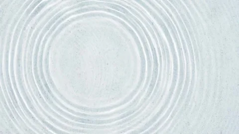 Abstract white sand beach from above with falling water drops Stock Footage 279833358