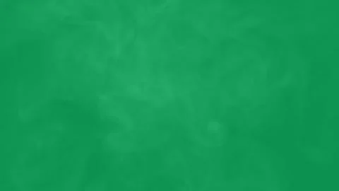 Abstract white smoke moving slowly across a solid green background. Video stock 345112248