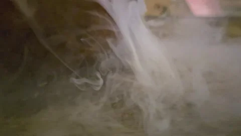 Abstract white smoke swirling through dark water, with soft cloudy trails Stock Footage 342663816