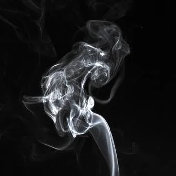 Abstract white smoke swirls pattern over the black background Stock Photos