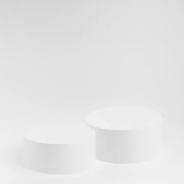 Abstract white stage with two round podiums as mockup. Template for presentat Stock Photos