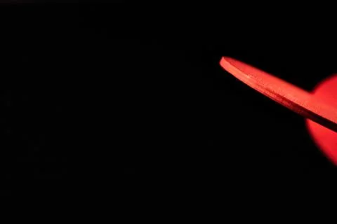 Abstract Wooden Red Shape in Complete Darkness Foto stock