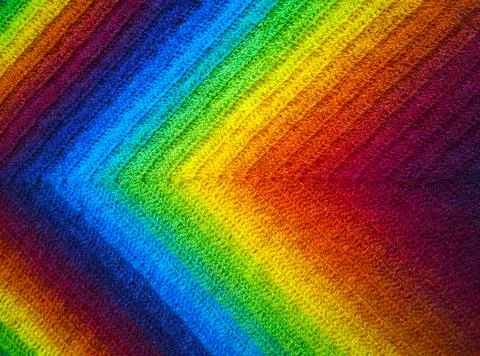 Abstract wool knitting background. Gradient of color of  rainbow: burgundy, dark Stock Photos