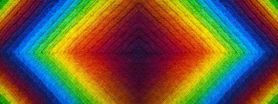 Abstract wool knitting background. Gradient of color of rainbow: burgundy Stock Photos