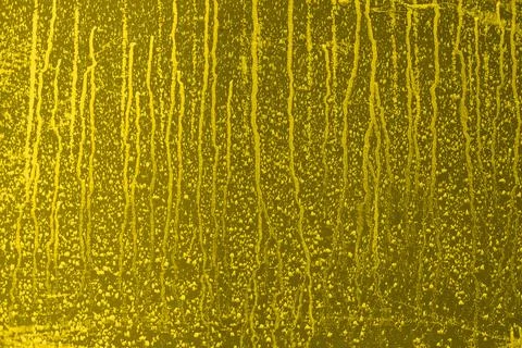 Abstract yellow background. Empty flat surface with white stains from water or Stock Photos