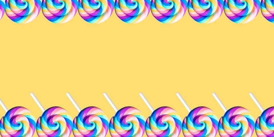 Abstract yellow background pattern with copy space and lollipops Stock Photos