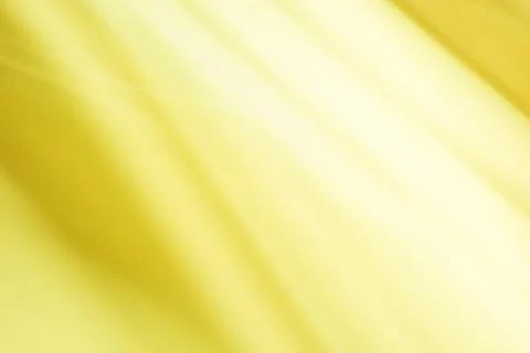 Abstract yellow background with some smooth lines in it and some rays in it Stock Photos