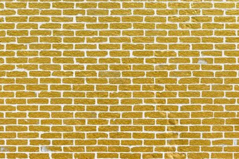 Abstract yellow brick wall texture. Pattern of Golden bricks wall background. Stock Illustration
