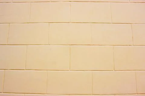 Abstract yellow brick wall texture depicting in paint colors on an old brick Stock Photos