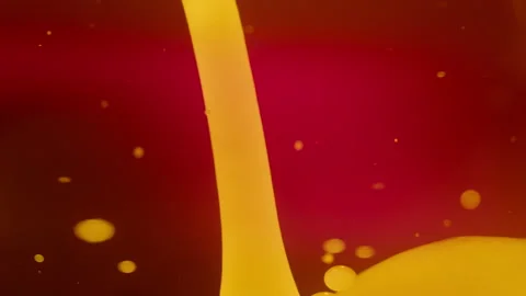 Abstract yellow lava bubbles floating in liquid on red background. Slow motion Stock Footage 293244834