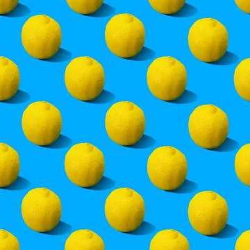 Abstract yellow lemons pattern on blue background Stock Photos