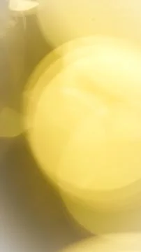 Abstract yellow light bokeh background with soft circular shapes Stock Photos