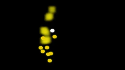 Abstract yellow light bokeh particles on solid black background Video stock 336326049