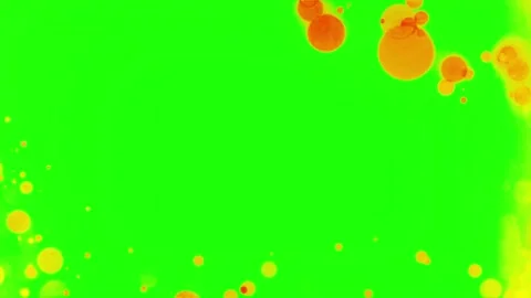Abstract yellow liquid paint splashes on a vibrant green chroma key background 스톡 동영상 341907415