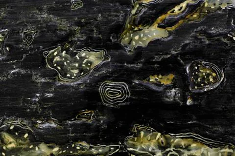 Abstract yellow pattern in black lacquer paint Stock Photos