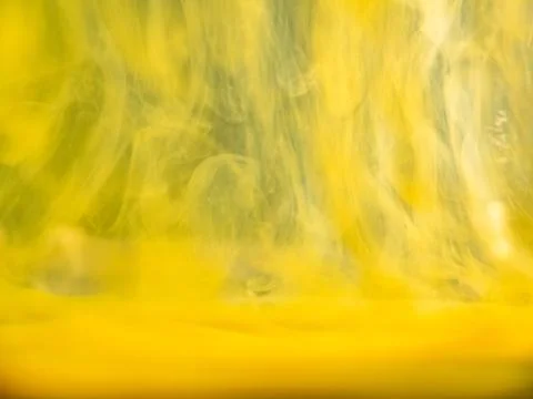 Abstract yellow pattern, close up view. Blurred background. Yellow acrylic flows Foto stock
