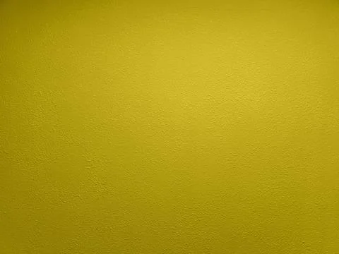Abstract yellow plaster wall flat full frame background Stock Photos