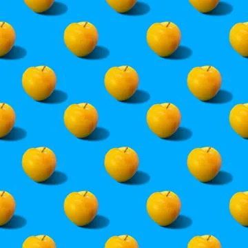 Abstract yellow plums pattern on blue background Stock Photos