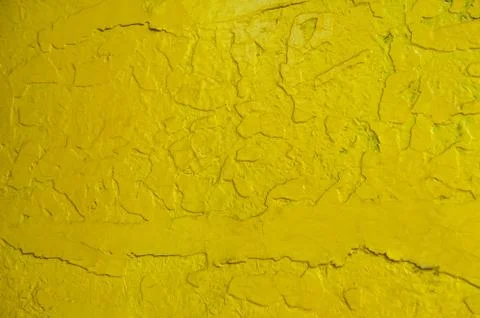 Abstract yellow solid background with cracks in the paint. Texture. A horizon Stock Photos