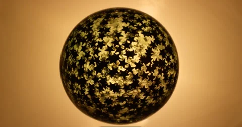 Abstract yellow sphere with star texture rotating. Stock Footage 146174715