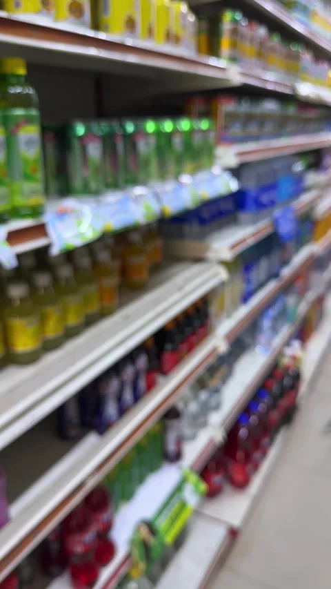 Abstracted Retail Aisle Dynamics: A Soft Focus Exploration of Diverse Consu.. Video stock 337284763