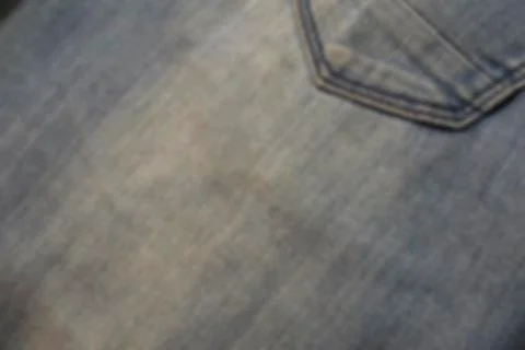 Abstraction blurred image of close up texture of back pocket blue denim jeans Stock Photos