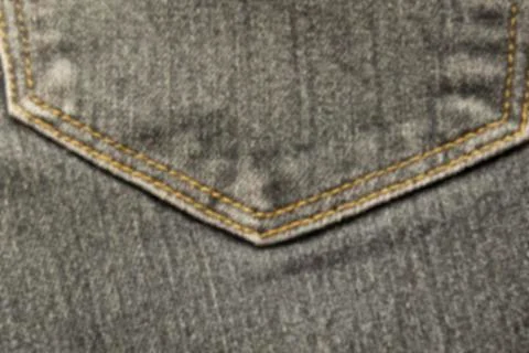 Abstraction blurred image of close up texture of back pocket blue denim jeans Stock Photos