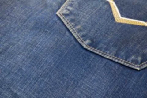 Abstraction blurred image of close up texture of back pocket blue denim jeans Stock Photos