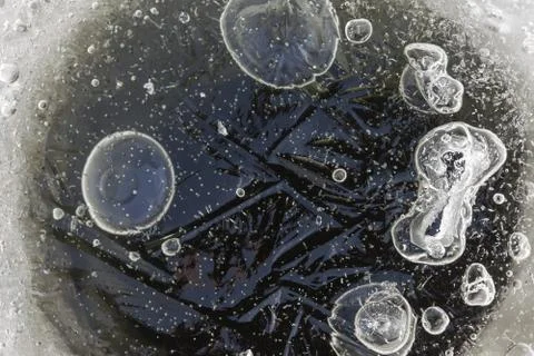 Abstraction. bubbles inside fresh ice macro closeup Stock Photos