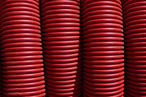 Abstraction created by the close-up of a red corrugated tube. Foto stock