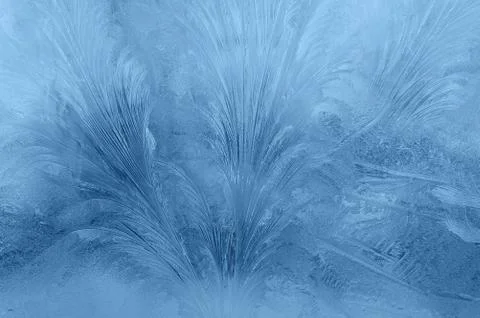 Abstraction of frosty patterns on the window Stock Photos