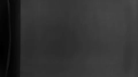 Abstraction. paint or smoke gets through the oil into the water Stock-Footage 106677071